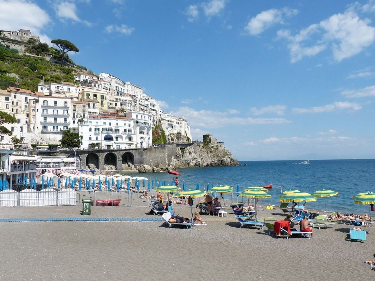 Italy And Spain Now Cheaper Than Türkiye For Holidays 10 Amalfi sandy beach with umbrellas and sunbathers
