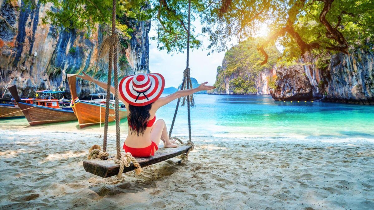 A woman tourist enjoys beach in Krabi, Thailand
