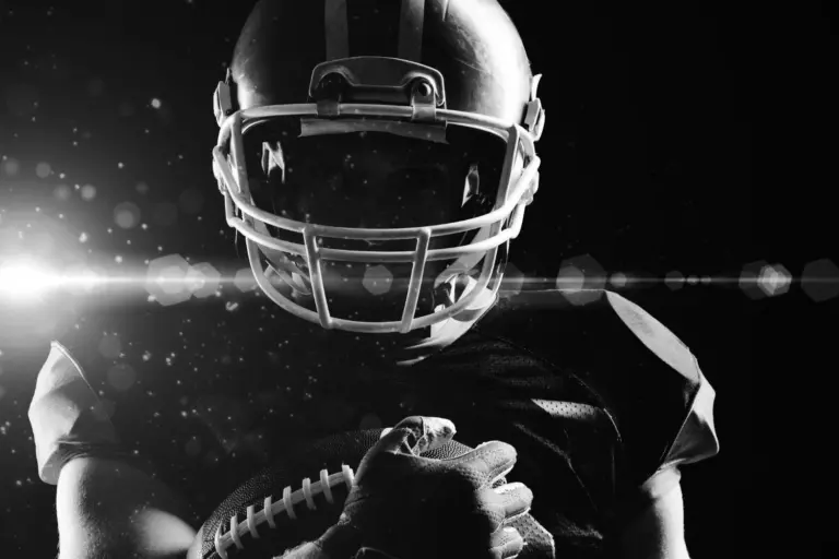 American football player with helmet and ball. black and white photo