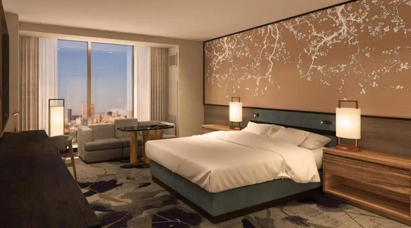 Luxurious guest room at Nobu Hotel Caesars New Orleans with modern decor and city view.