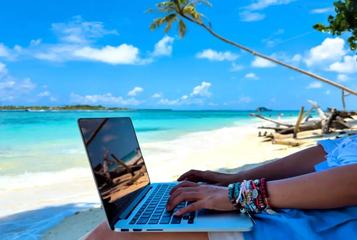 Digital nomad travel work by the beach