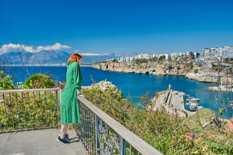 Woman overlooking the sea and mountains in Antalya