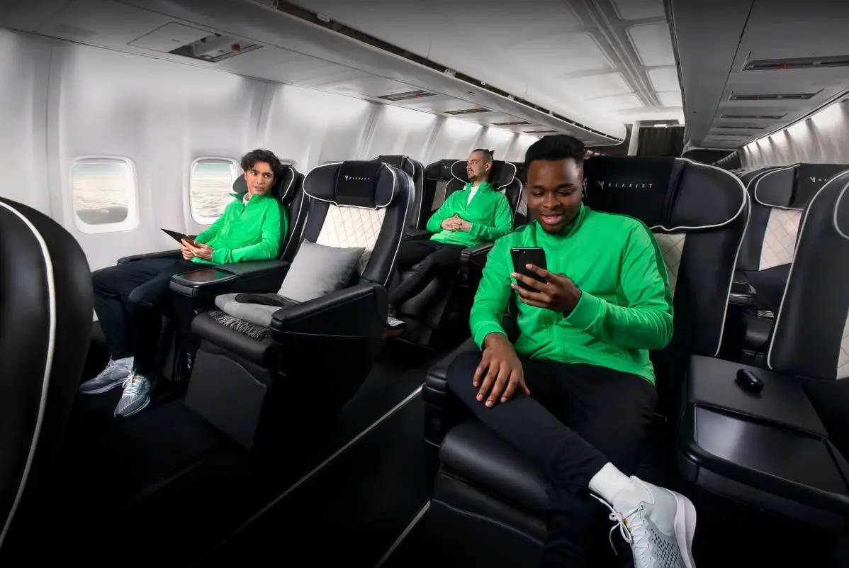 Fly Like A Champion: Private Jets Revolutionize Olympic Travel 2 3 athletes in sportswear fly on a private charter plane