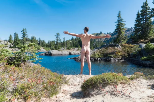 nudist man enjoys beach and nature