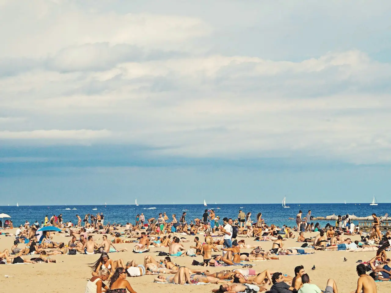 Crowded Barcelona beach unsplash