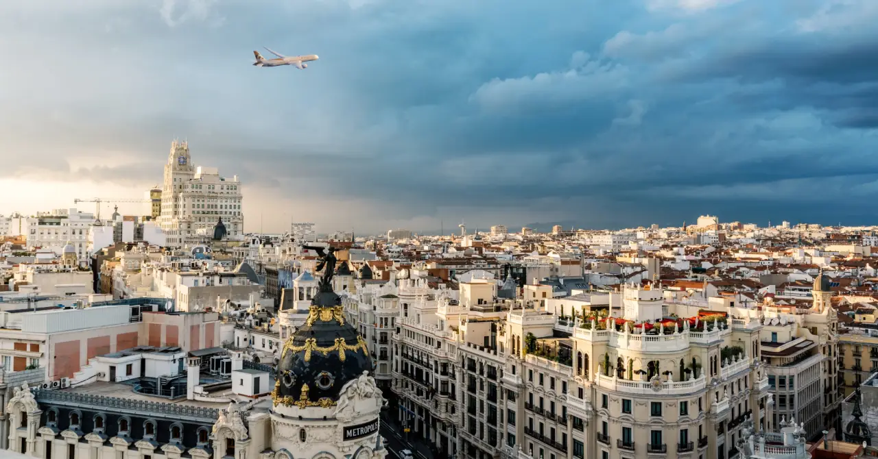 Etihad Cargo aircraft is flying over Madrid, Spain