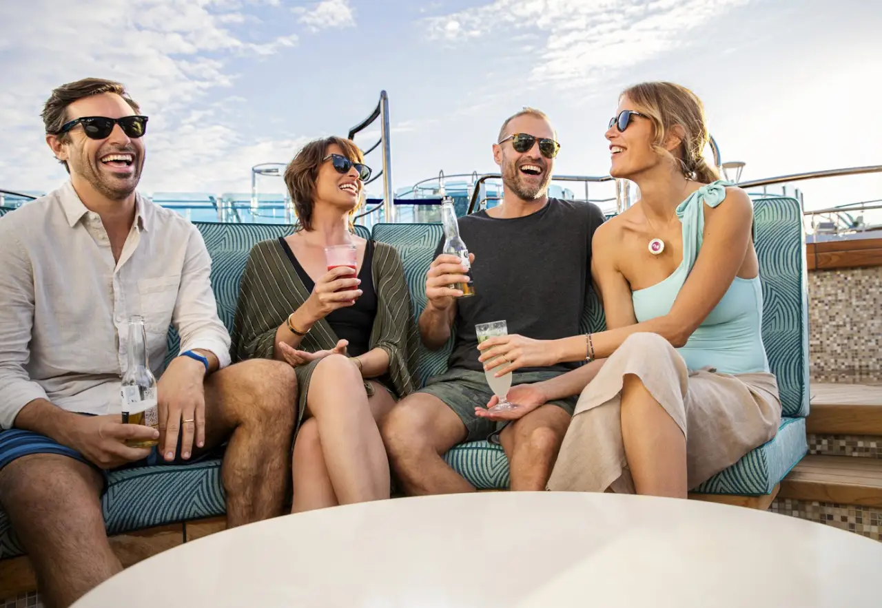 Double Your Rewards: Princess Cruises' Limited-Time Loyalty Offer 7 Two couples sit together onboard Princess Cruises enjoy their drinks in a warm day, Princess Cruises loyalty members