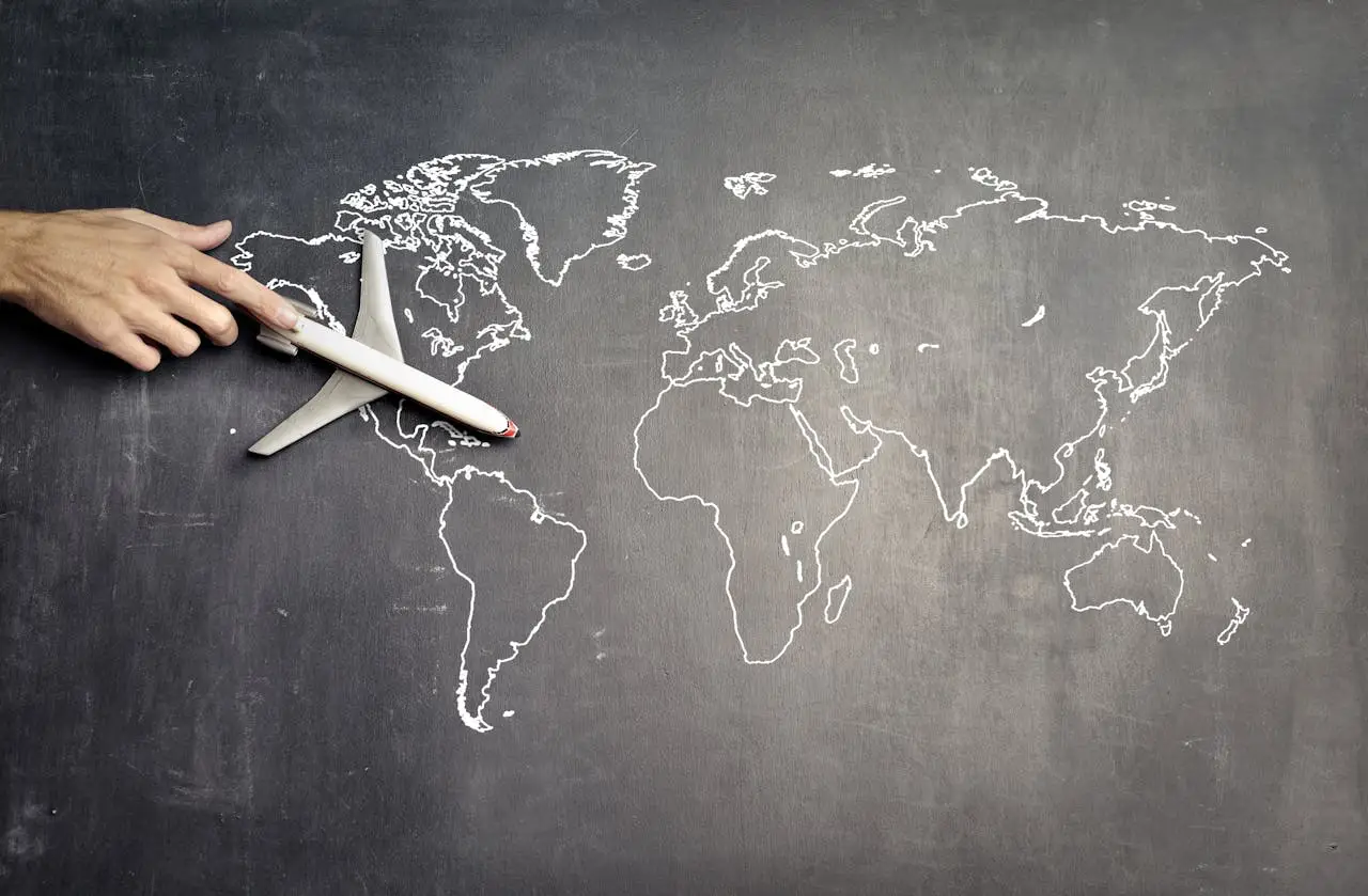 Miniature airplane and hand of person over drawn map, Skycop