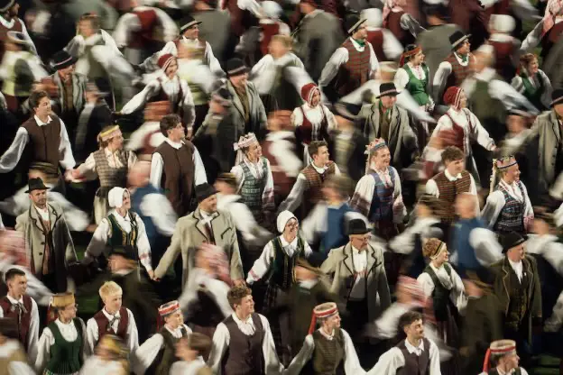 Lithuanian choir hand in hand and traditional dresses singing