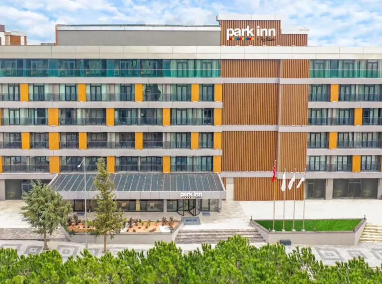 Exterior view of the Park Inn by Radisson Yalova City Center hotel in yellow and darker tones