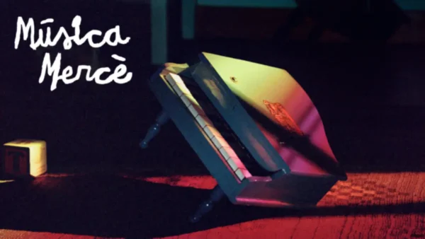 Promotional image for Música Mercè 2024 featuring a small toy piano under colorful lighting.