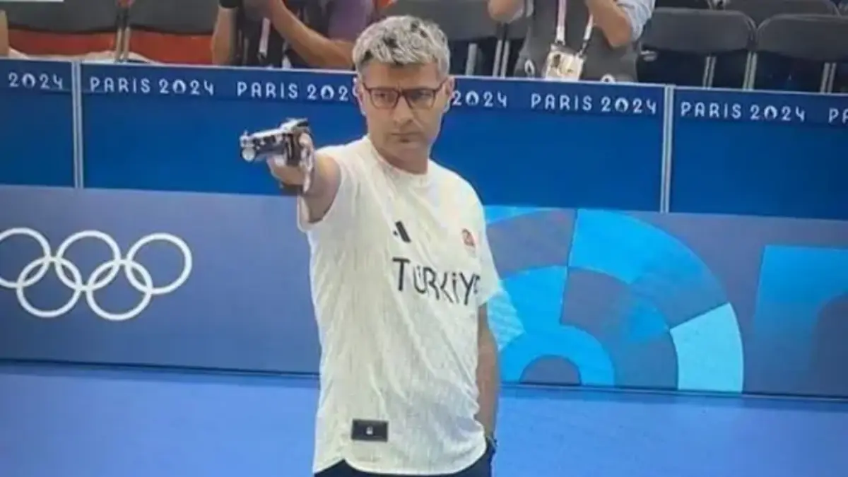 Turkish shooter Yusuf Dikec competing at the 2024 Paris Olympics in the mixed team 10m air pistol event.