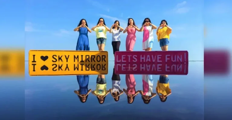 A group of women posing with reflective signs at Sky Mirror, Malaysia.