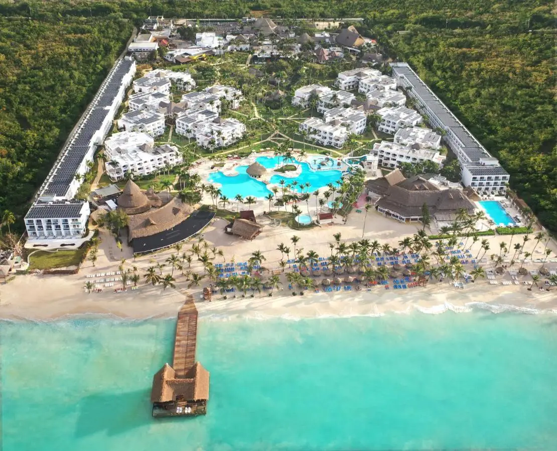 An aerial view of Sunscape Dominicus La Romana Resort, featuring beachfront access, a large pool and lush tropical gardens.