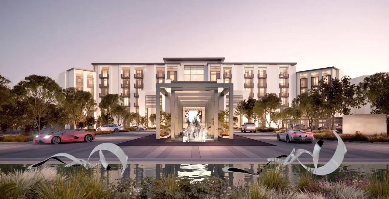 Exterior view of Waldorf Astoria Abu Dhabi showcasing modern architectural design and a grand entrance with water features.