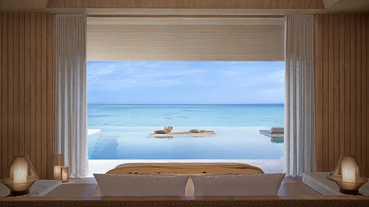 A luxurious 1-bedroom beach pavilion at Aman Maldives, featuring an infinity pool overlooking the serene turquoise waters of the Indian Ocean.