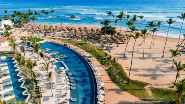 Beachfront pool at Secrets Tides Punta Cana, one of the latest all inclusive resorts in the Dominican Republic, offering ocean views and palm tree-lined beaches.