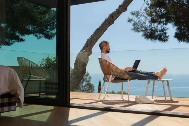 Technology 22 Digital nomad working outdoors at a warm winter destination in Europe.