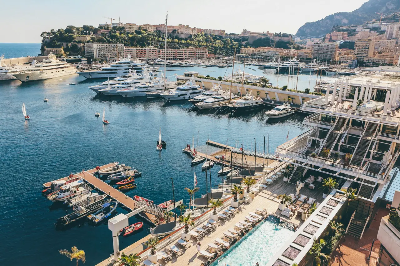 Why Yacht Charter In Monaco Is The Perfect Choice For A Luxurious Vacation 2 monaco port hercule luxury yachts poolside view