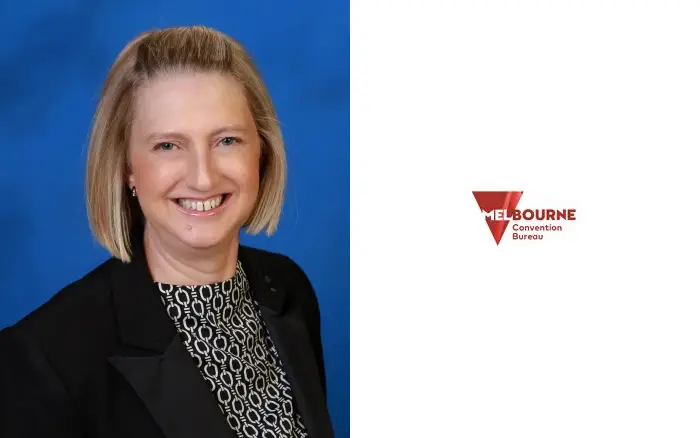 Nicolena Oborn, the newly appointed Chief Sales and Customer Experience Officer at Melbourne Convention Bureau, smiling in a professional portrait. She is wearing a black blazer and patterned blouse, with a Melbourne Convention Bureau logo displayed beside her.