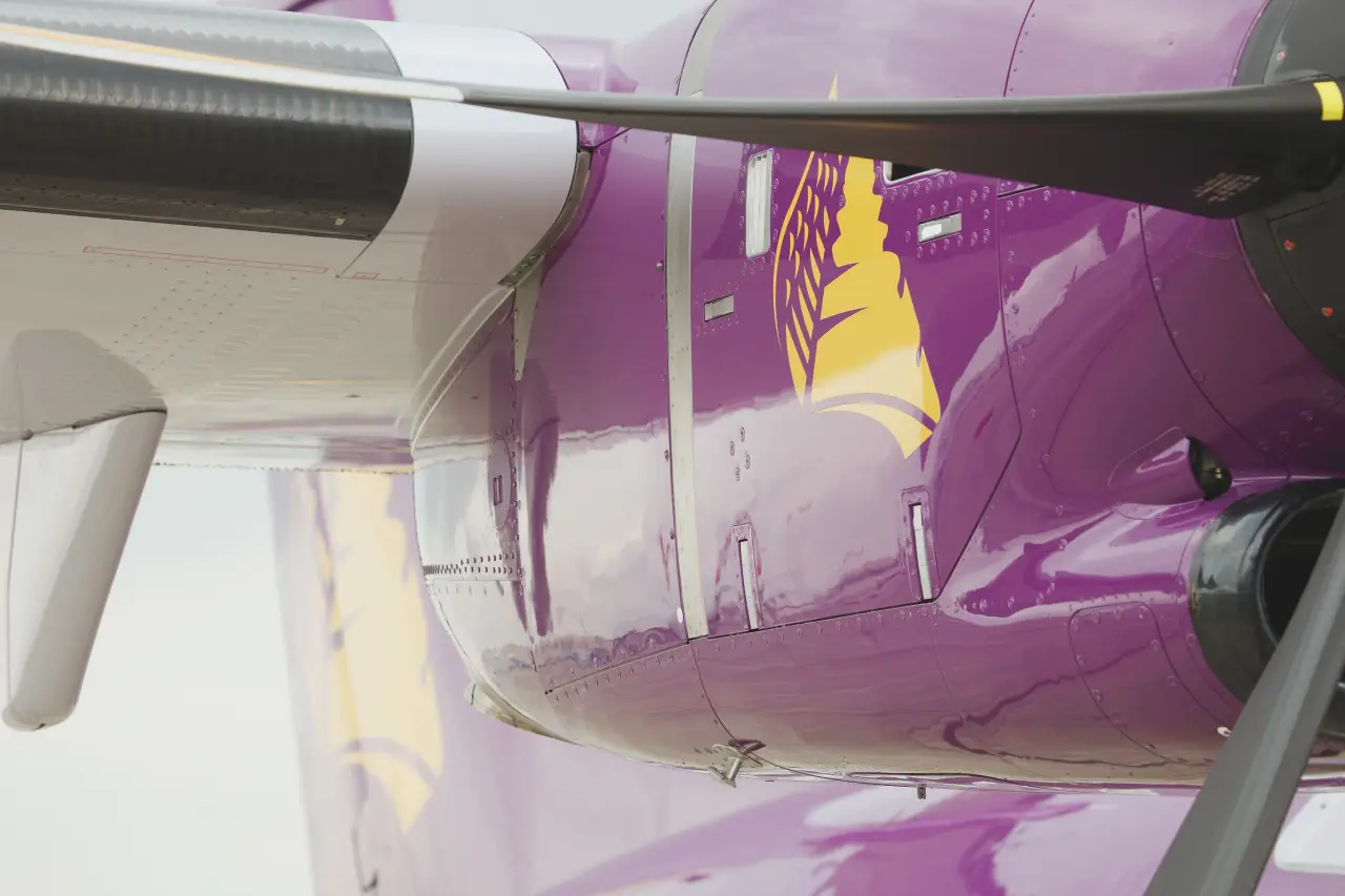 Close-up of an ATR 72-600 aircraft engine with Cambodia Angkor Air branding.