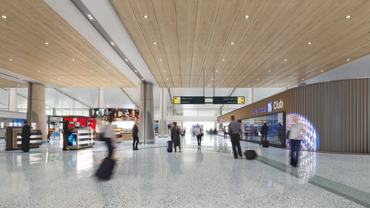 Rendering of the new Concourse E at Washington Dulles International Airport, featuring a spacious design with modern retail areas, signage, and a United Club entrance.