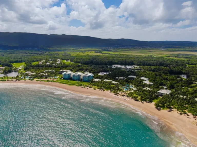 Luxury Travel 26 Aerial view of Four Seasons Resort Puerto Rico at Bahia Beach surrounded by lush greenery and the ocean.
