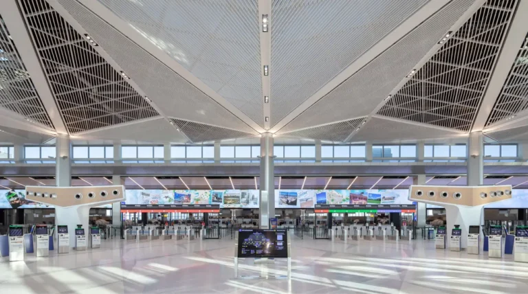 Aviation 25 Modern departures hall at Newark Liberty International Airport (EWR), one of the best US airports for flights to Europe, with check-in kiosks and sleek design.