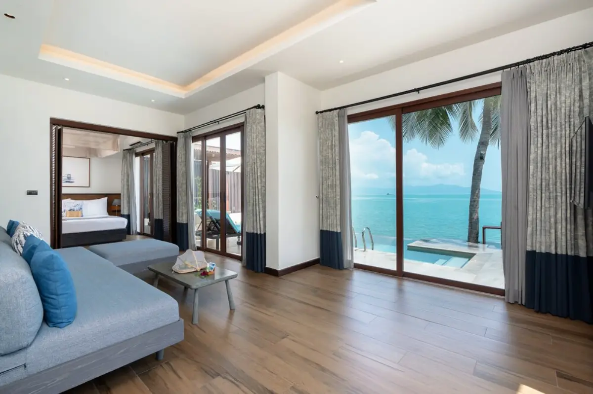 Luxurious villa interior with ocean view, private pool, and modern furnishings at NH Collection Samui Peace Resort.