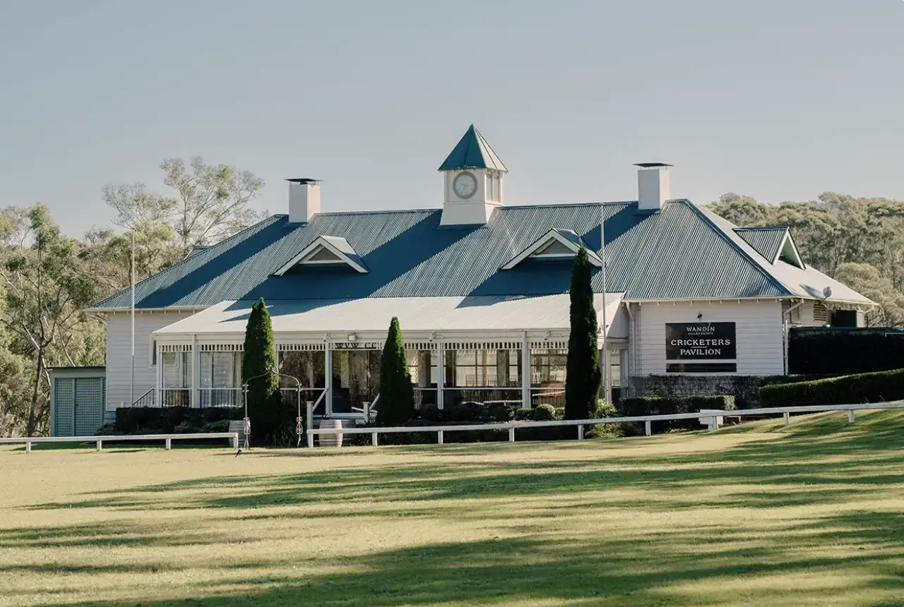 Wandin Estate Cricketers Pavilion in Hunter Valley, Australia, surrounded by greenery.