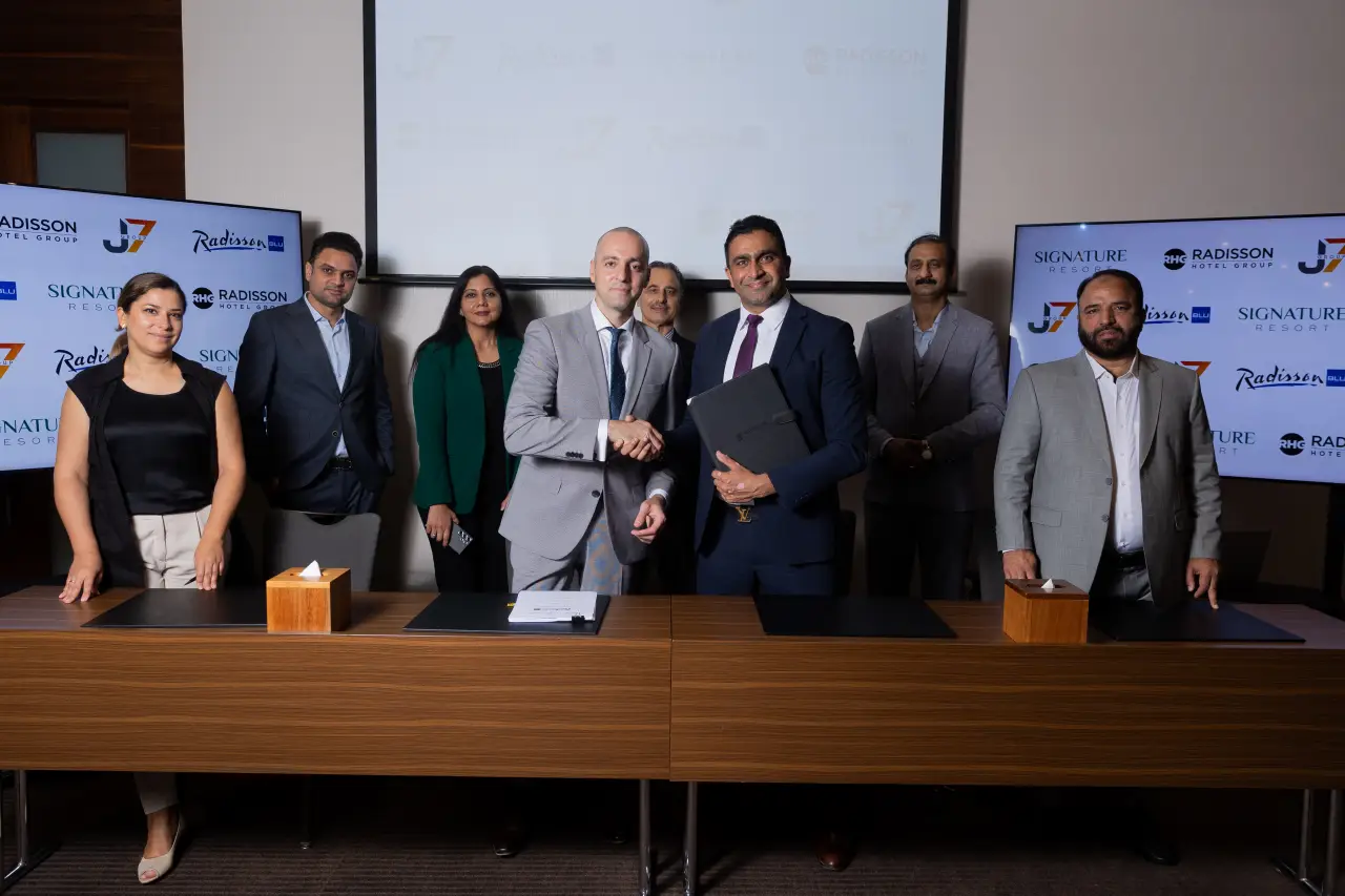 Signing ceremony for the Radisson Blu Resort, Murree, Pakistan, featuring representatives from Radisson Hotel Group and Signature Resort.