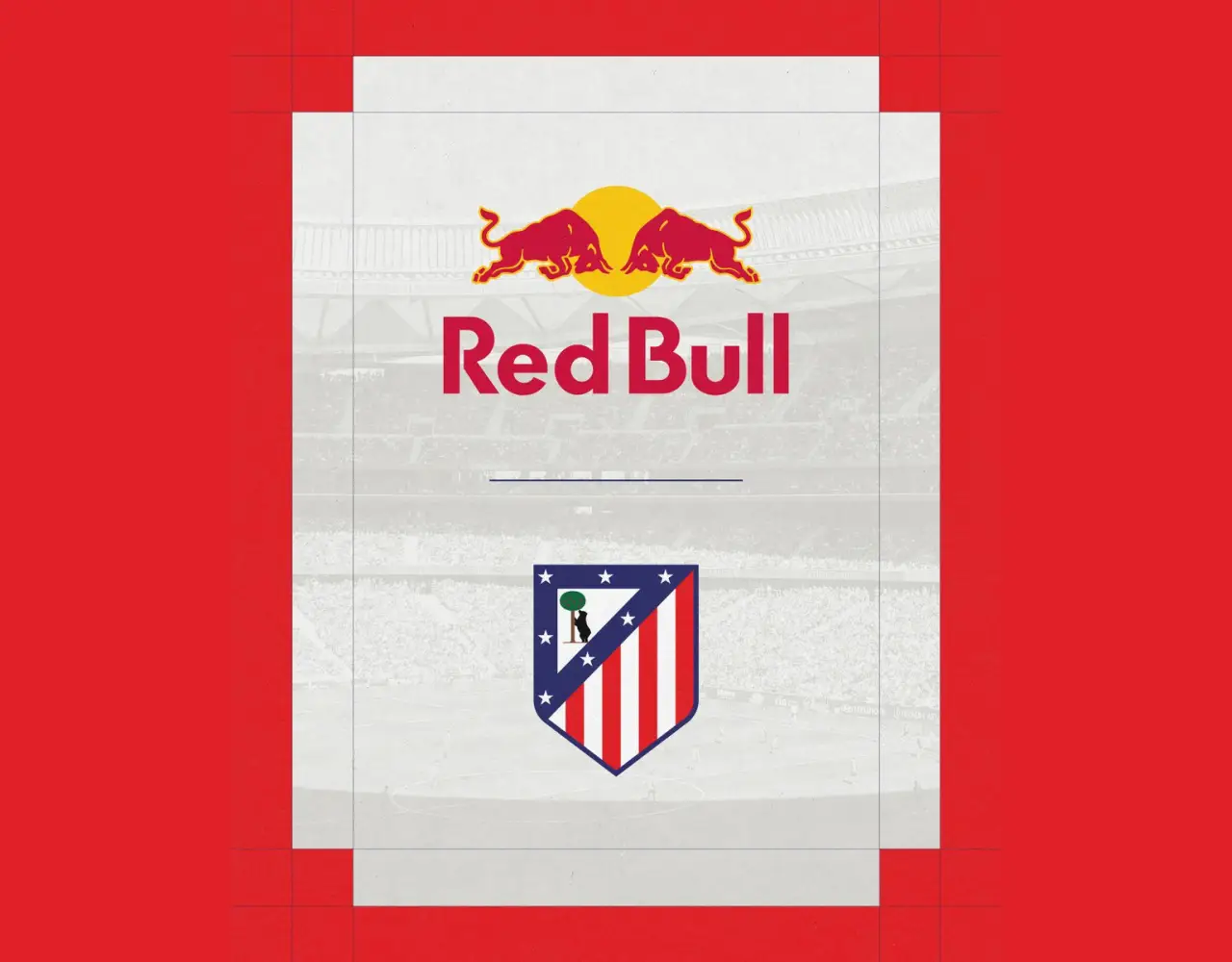 Red Bull logo above Atlético Madrid’s crest with a stadium background, highlighting their new sponsorship partnership.