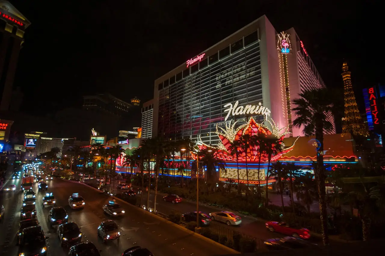 Las Vegas Strip at night featuring the Flamingo Hotel and neon lights.