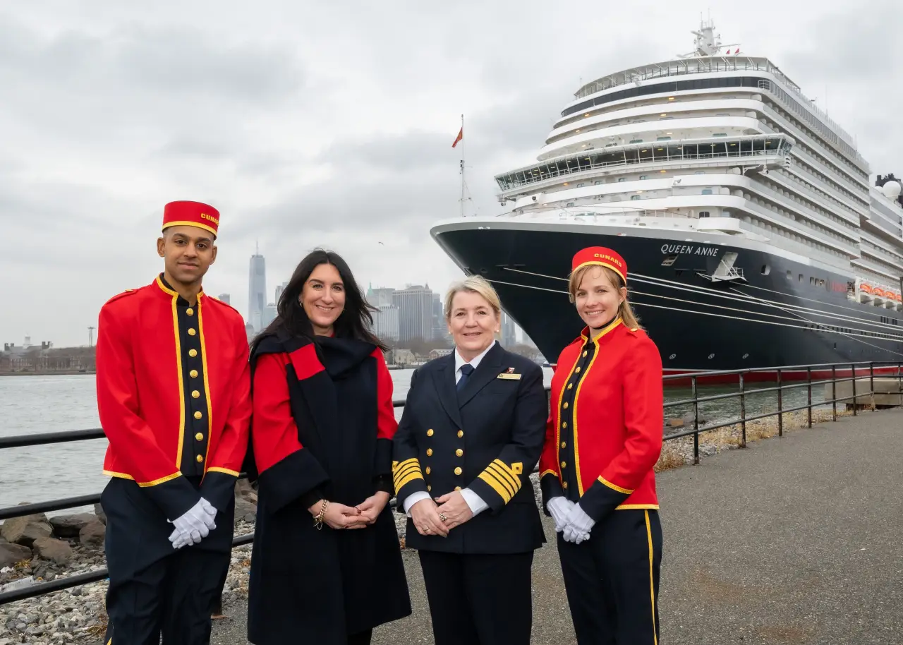 Cunard’s New Ship Queen Anne Embarks On Maiden World Voyage 6 Cunard’s Queen Anne docked in New York with Captain Inger Klein Thorhauge, Katie McAlister, and Cunard staff in iconic red uniforms.