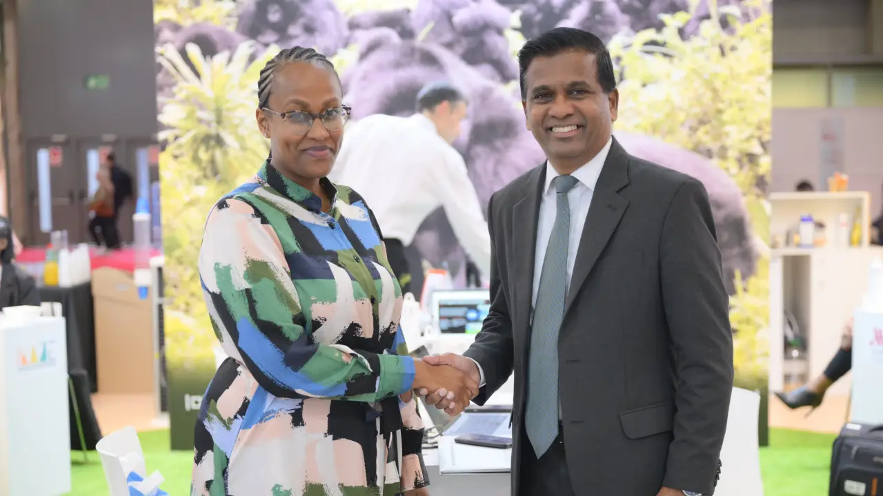 Janet Karemera, CEO of Rwanda Convention Bureau, and Senthil Gopinath, CEO of ICCA, shaking hands at a professional event.