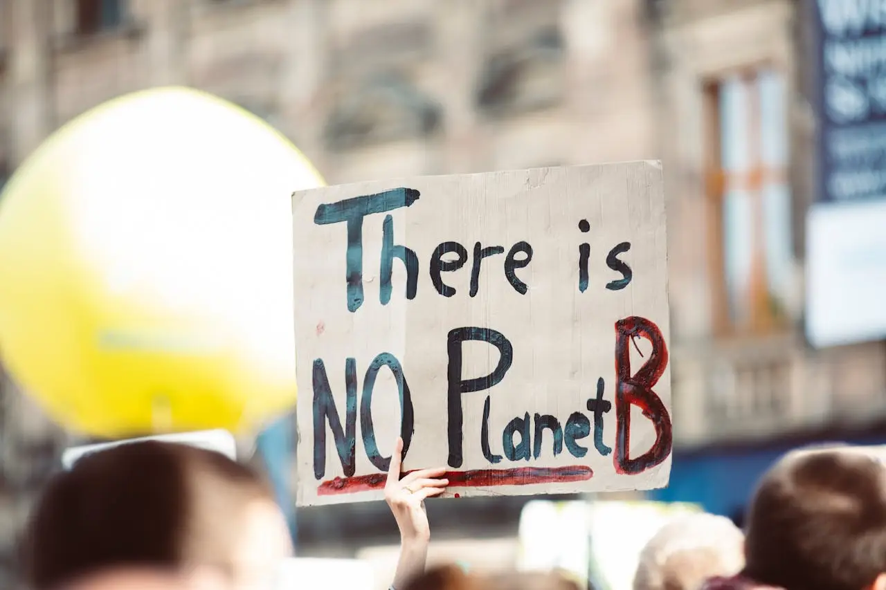 A protester holds a sign reading “There is NO Planet B” during a climate change demonstration.