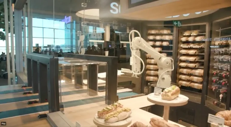A robotic arm at SELF, the AI-powered restaurant in Barcelona Airport, preparing and delivering meals.