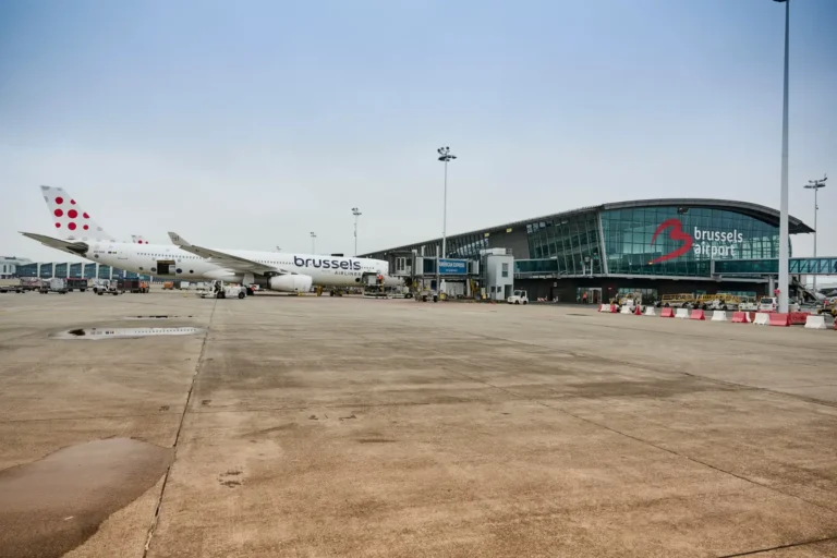 Brussels Airlines aircraft parked at the terminal of Brussels Airport on a cloudy day