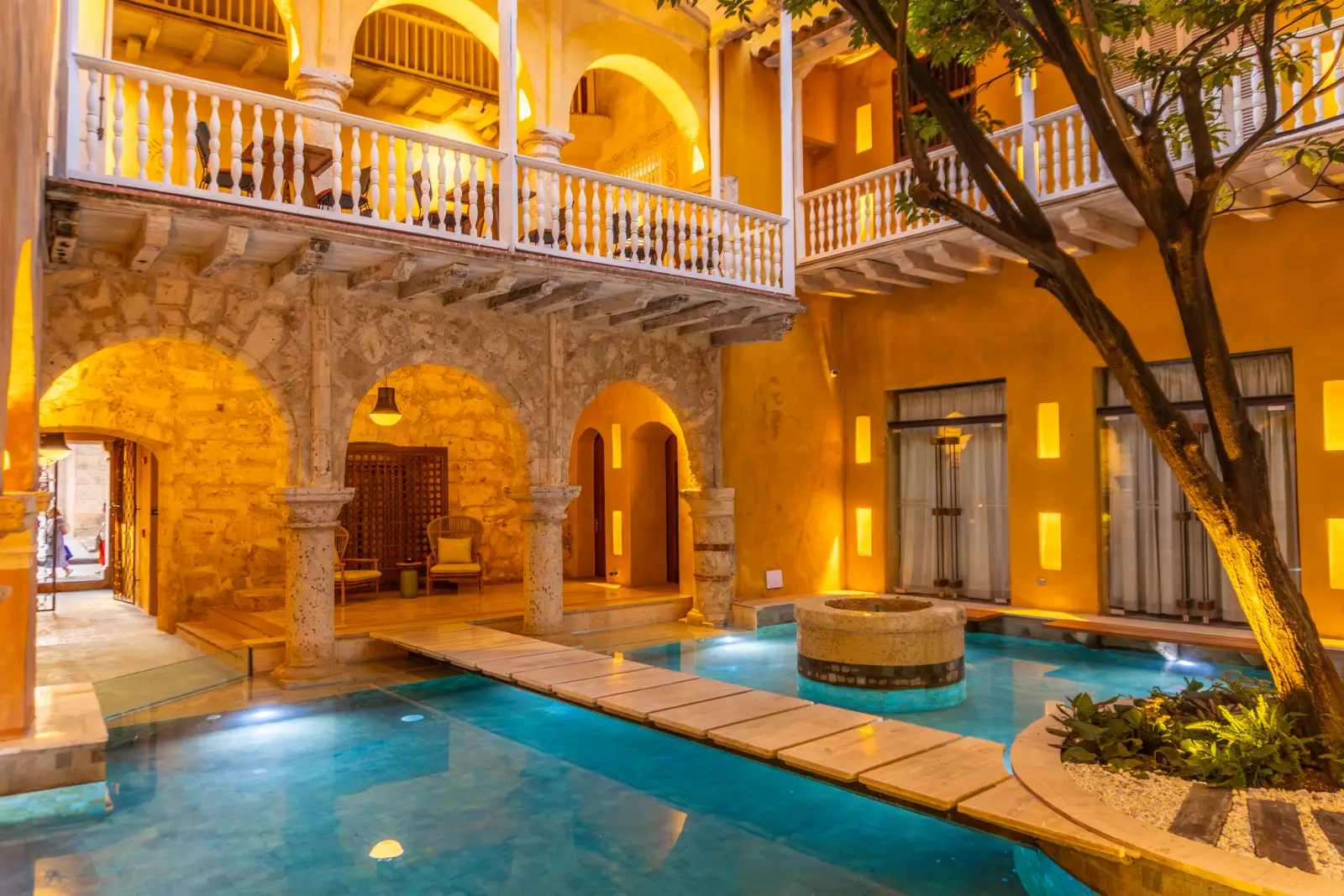 Elegant colonial-style courtyard with a pool at Casa Carolina in Cartagena, Colombia.