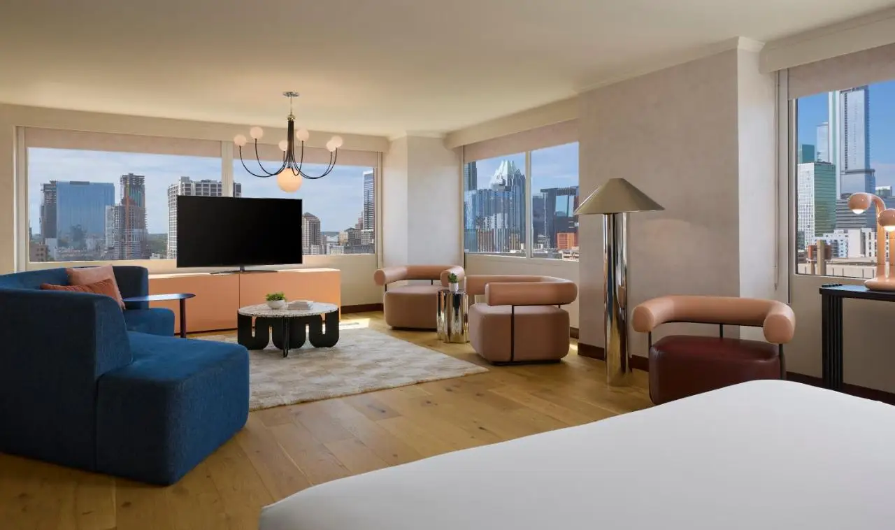 Stylish hotel suite in Downright Austin with city skyline views.