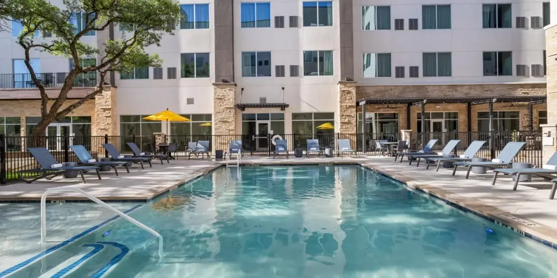 EVEN Hotels Austin building exterior on a sunny day.