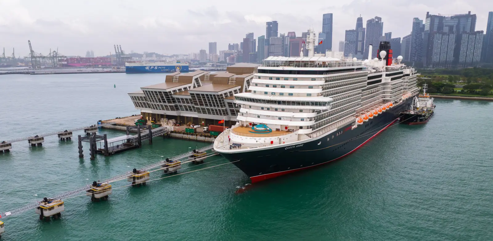Cunard’s Newest Ship Queen Anne Makes Maiden Call To Singapore 5 Cunard’s Queen Anne cruise ship docked at Marina Bay Cruise Centre with the Singapore skyline in the background.