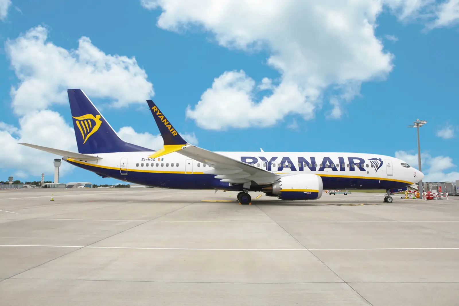 Ryanair Boeing 737 aircraft parked on the tarmac under a blue sky.