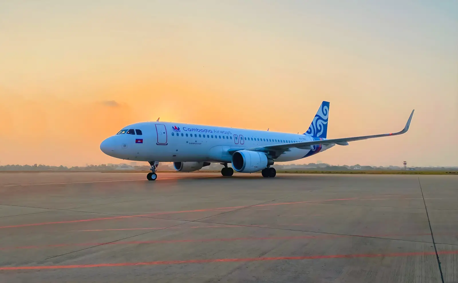 Cambodia Airways aircraft on the runway during sunrise