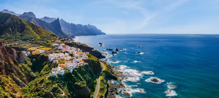 Canary Islands coastline with colorful hillside village and Atlantic Ocean view