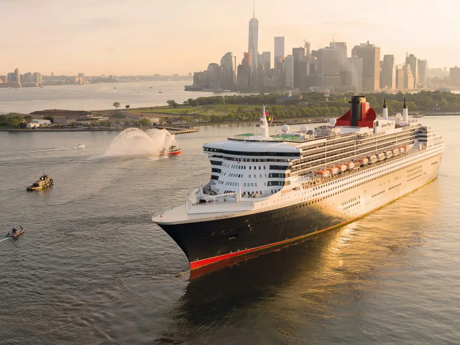 Norovirus Hits Queen Mary 2 During Caribbean Voyage From England 4 Queen Mary 2 cruise ship sailing past New York City skyline at sunset