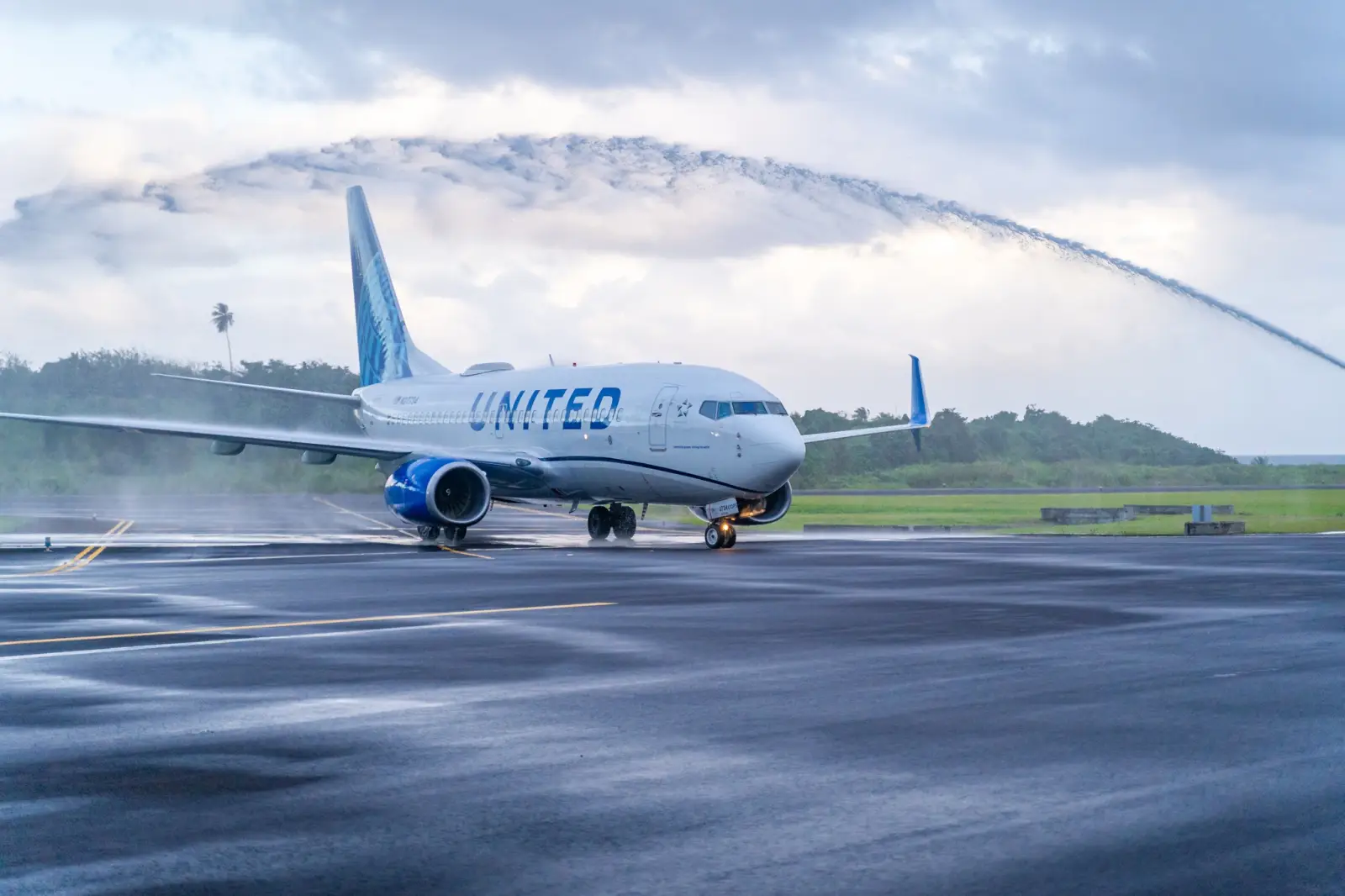 United Adds New Flights To Bangkok, Ho Chi Minh City, Adelaide, Manila 6 United Airlines aircraft taxiing under ceremonial water cannon salute on wet runway