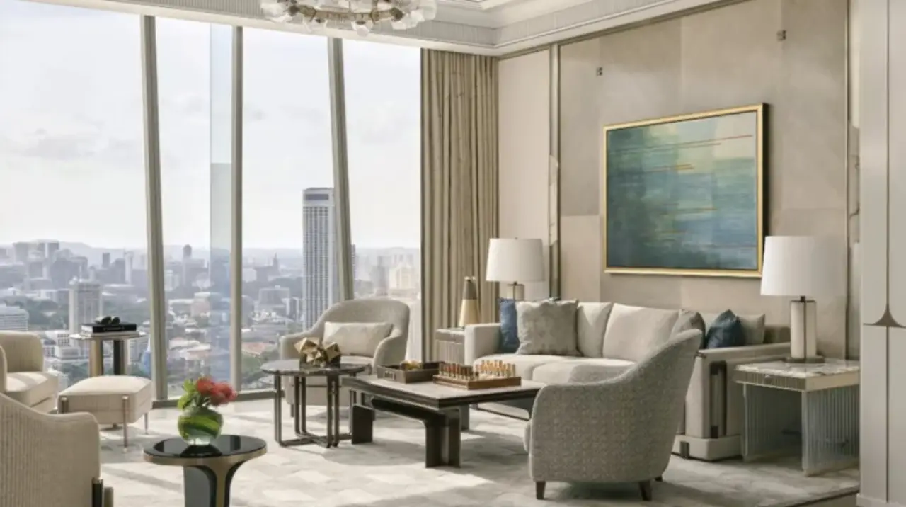 Interior view of Marina Bay Sands’ renovated Chairman Suite featuring plush seating, modern decor, and panoramic skyline views of Singapore.