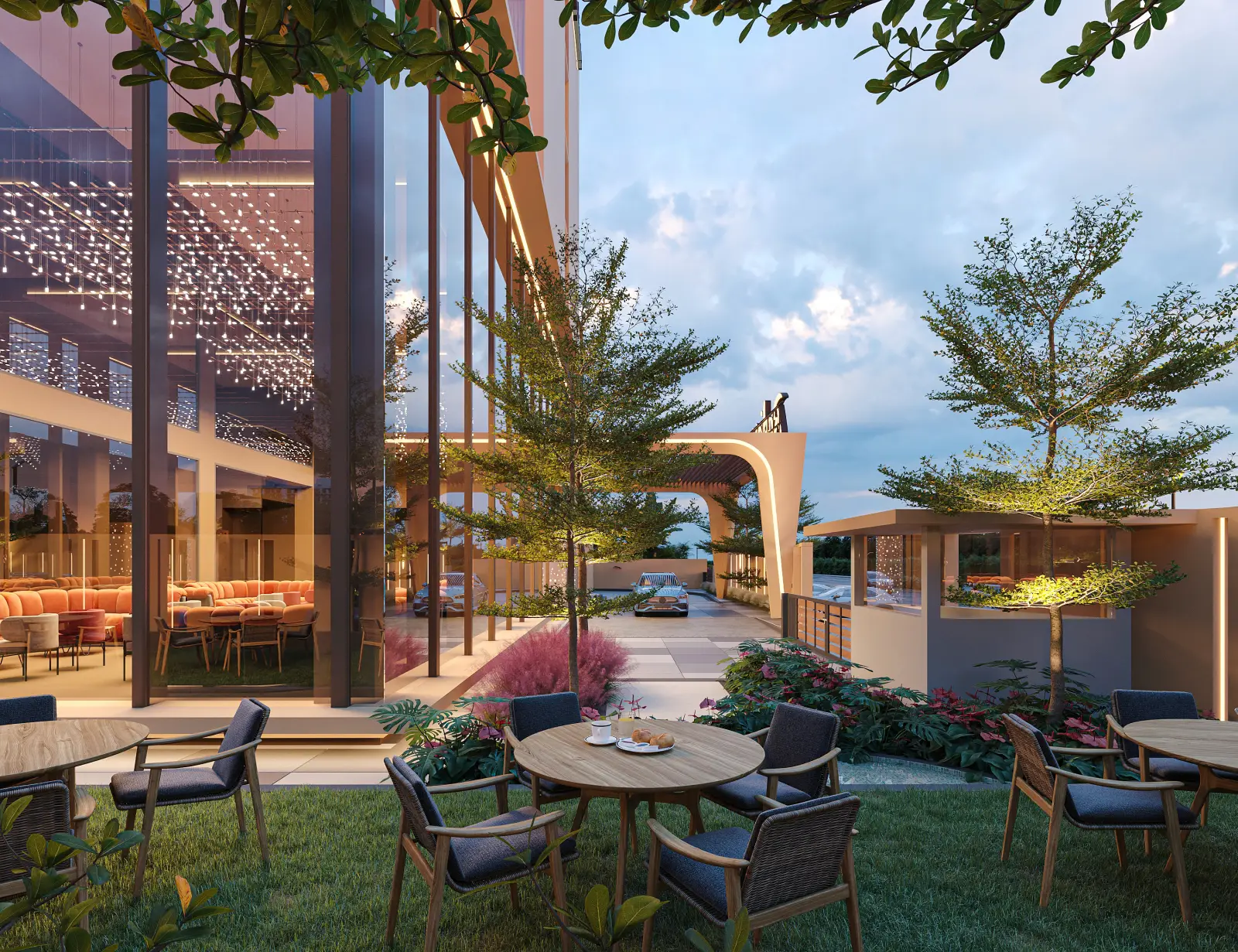 Radisson Hotel Group Expands With New Openings In Africa 3 Outdoor terrace of Radisson Hotel Lubumbashi with dining tables, greenery, and modern architecture at dusk.