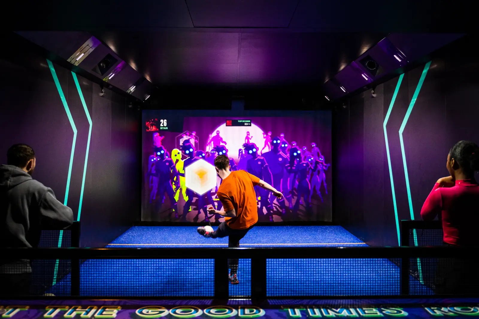 Toca Football Secures $35M To Expand Soccer Entertainment 8 Person playing an interactive soccer game at a TOCA Football entertainment venue